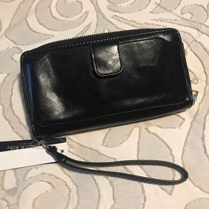 Black wallet with zipper all around and a place for the cell phone  with tags
